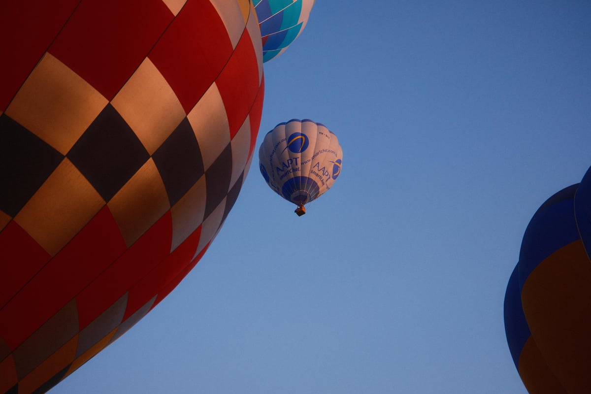 Hot air balloons lifting over Canberra during the balloon spectacular.